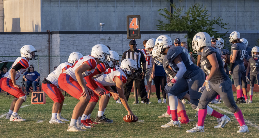 The Spartan team begins a play. (Chris Caselli)