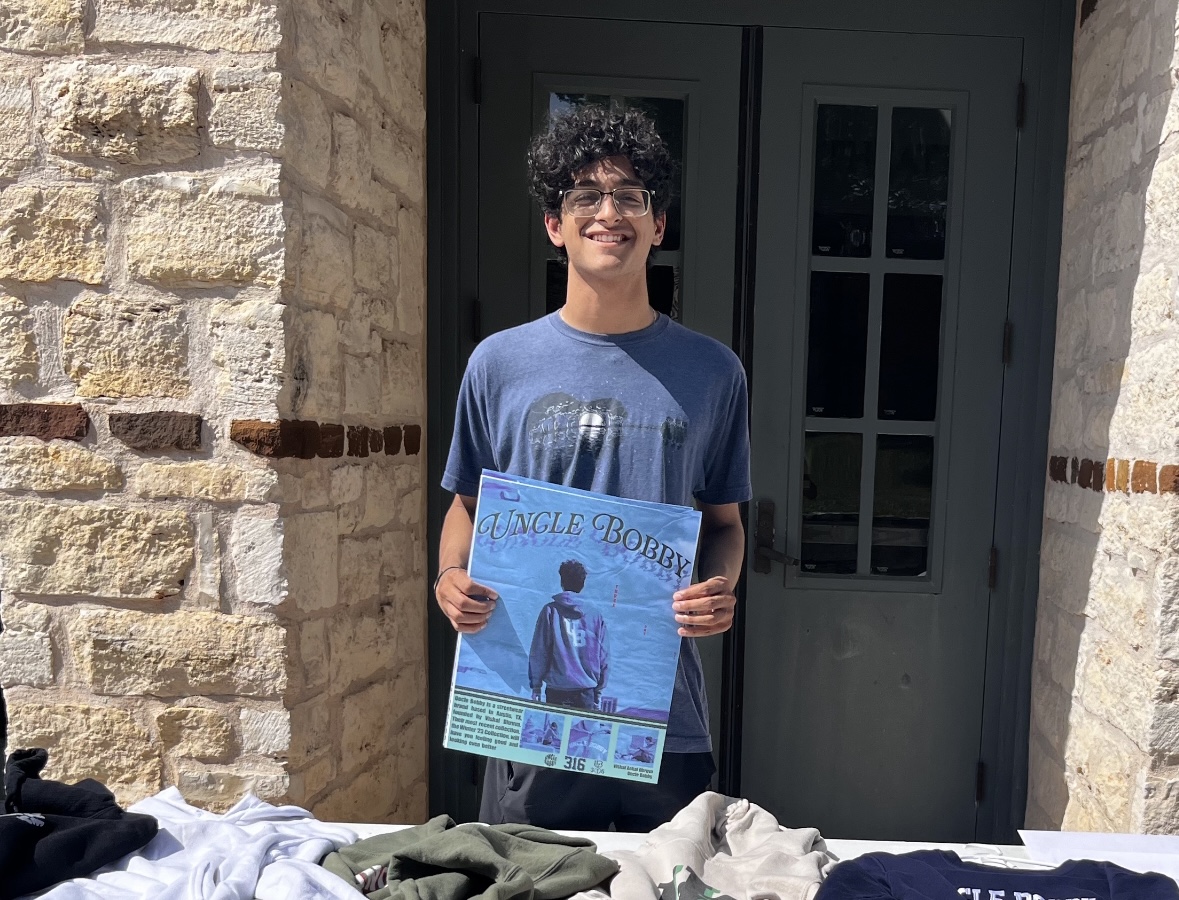 Vishal Dhruva ('25) with a piece of "Uncle Bobby" merch.